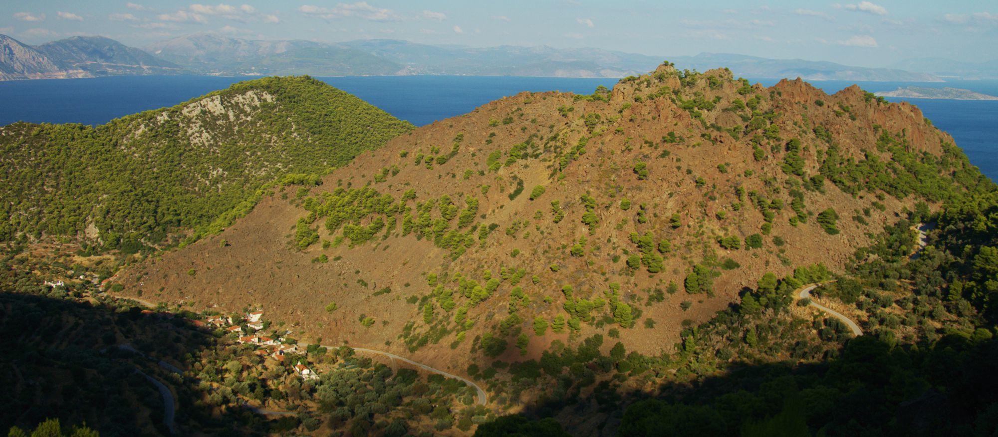 The vegetation of Methana peninsula: Kameni volcano landscape is covered by low phrygana and scattered pines